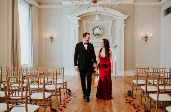 bride in red wedding dress with groom before wedding at The Vancouver Club